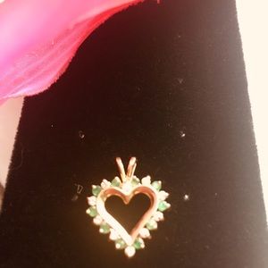 14 Karat Gold Emerald and diamond heart pendant.